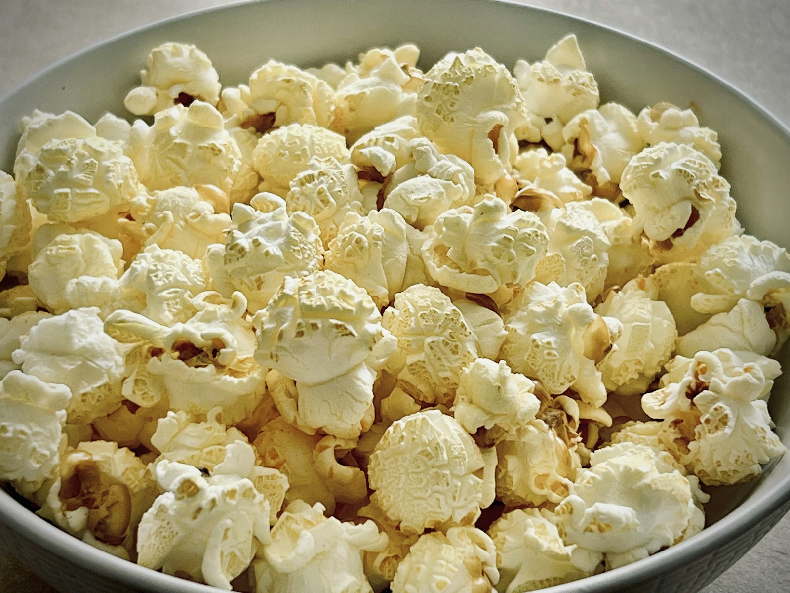 Buttery popcorn in a bowl, close up